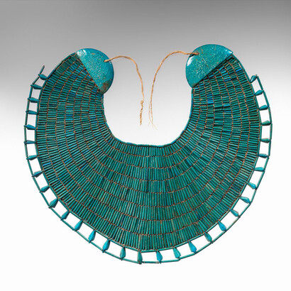 Middle Kingdom
Dynasty:Dynasty 12
Reign:reign of Amenemhat I, early
Date:ca. 1981–1975 B.C.
Geography:From Egypt, Upper Egypt, Thebes, Southern Asasif, Tomb of Wah (MMA 1102), Mummy, in wrappings on chest, MMA excavations, 1920
Medium:Faience, linen thread
Dimensions:H. 34.5 cm (13 9/16 in.); W. 39 cm (15 3/8 in.)
Credit Line:Rogers Fund and Edward S. Harkness Gift, 1940