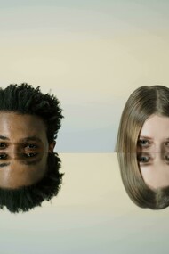 Man and woman standing against a mirror, reflecting on the role of the placebo effect in treatment outcomes