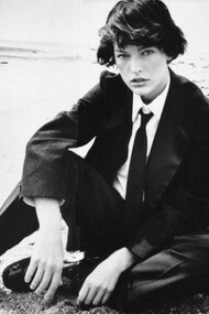 The famous actress and model Milla Jovovich, dressed like a man