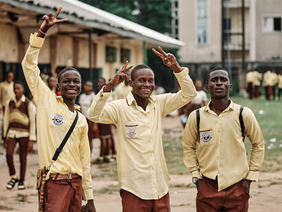 Beaming with joy as connections transcend distance, these Nigerian students share smiles, thanks to the transformative power of mobile phones, bridging communities and fostering friendships effortlessly