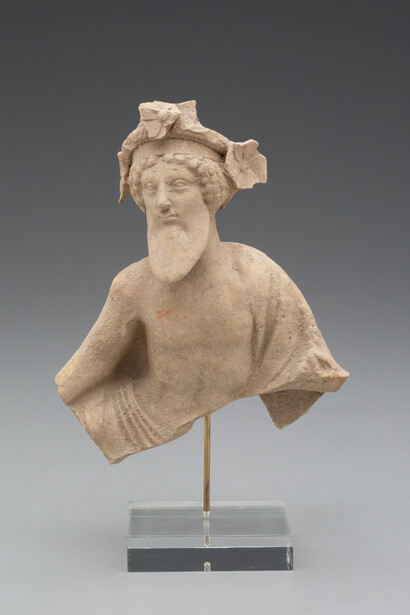 Figure of Dionysos
ca. 480–400 B.C.
Orange-colored clay, possibly with traces of paint

17.8 cm (7 in.)base (base): 15.2 cm(6 in.)
Gift of Molly and Walter Bareiss, B.S. 1940
2001.