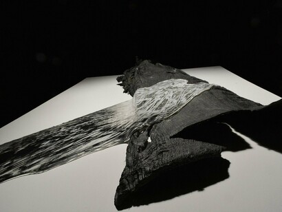 Tomoko Amaki Abe, Hair and Autopart, 2023, Cast glass, automobile part, 48 x 32 x 4 inches.Courtesy of A.I.R Gallery