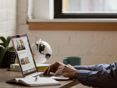 A person creating a brochure to showcase their business