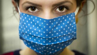 A masked woman stared the coronavirus pandemic crisis in the eyes as she tackled her day
