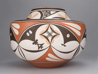 This olla, or pot, was made by Max Early (Laguna Pueblo) to be a companion for a 125-year-old pot in the Field Museum’s collection, which was made by a 19th century potter known as Arroh-ah-och. Arroh-ah-och lived in the village where Max lives. Both vessels share a design element of approaching clouds and circular beaks. Courtesy of Field Museum