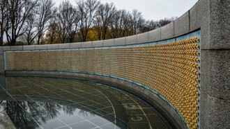 Side view of the National World War Two Memorial Wall in Washington, DC, adorned with 4,048 gold stars; each represents 100 Americans who died during the Second World War