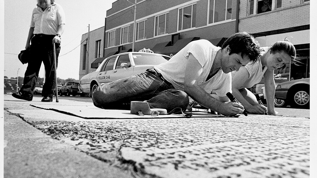 Kate Ericson and Mel Ziegler working on the public art project Loaded Text in Durham, North Carolina, 1989