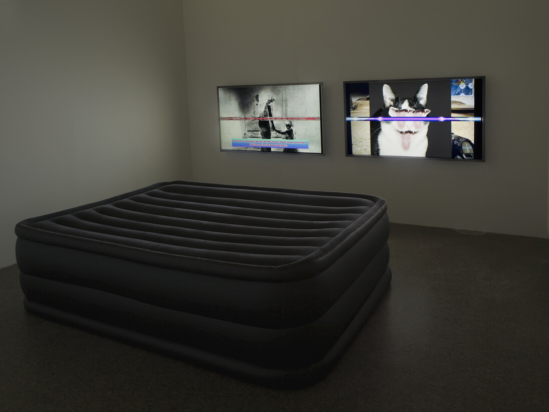 Clunie Reid, In Pursuit of the Liquid, 2013, Two screen HD videos on 50” flat-screen monitors, inflatable mattress, Courtesy the artist and MOT International
