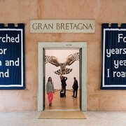 Jeremy Deller walks towards the entrance of the British Pavilion, where his installation English Magic is on show