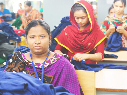 A worker oversees garment production on the factory floor of a clothing plant in Bangladesh photo by 
International Labour Organization 