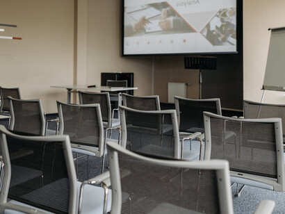 Empty chairs in a conference room, representing the disinterest in previous World Social Forum meetings before 2024's meeting in Kathmandu, Nepal