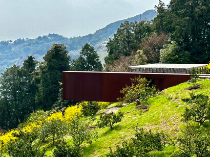 View of Winter Solstice Light-Worship Tunnel and Optical Glass Stage from the garden © Alma Reyes