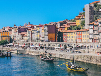 In Porto, Portugal, the pristine white buildings line the picturesque waterfront, creating a stunning contrast against the azure waters