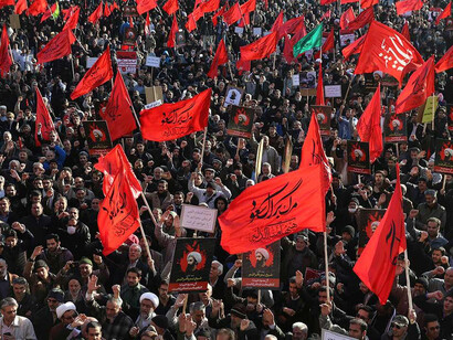 Iranian demonstrators chant slogans and hold anti-Saudi placards and flags