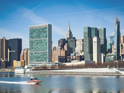 The shoreline of the East River with the Headquarters of the United Nations in New York City, USA