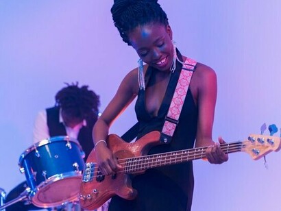 A Black performer embracing the rhythm with confidence, symbolising generations of artistic excellence and cultural pride