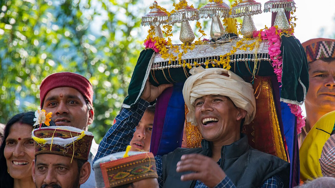 A group of people in traditional Himachali attire gathered in a circle, Kullu Valley, Himachal Pradesh, India