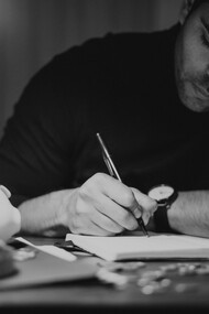 A writer sat at his desk working 