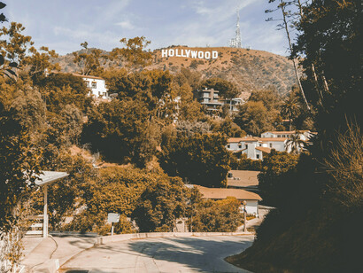 Hollywood sign overlooking houses and vegetation, Los Angeles, USA
