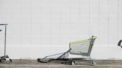An abandoned shopping cart as a symbol for lost customers, reflecting the impact of neglecting consumer needs and expectations