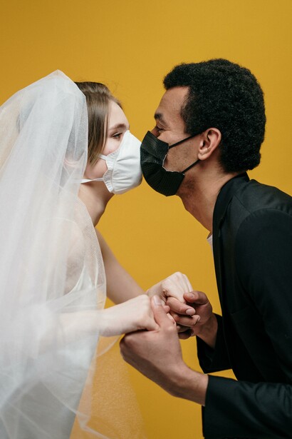 A married couple wearing protection against the spread of the Covid-19 Pandemic