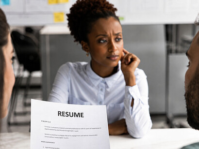 Company HR team interviewing an African American woman during a professional job interview