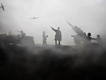 World War II soldiers and armored vehicles are silhouetted against a foggy sunset sky, creating a tense battlefield scene