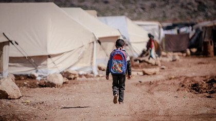 Walking through the refugee camp in Syria, this child embodies the hope for a brighter future, a vision all of humanity must strive to realise