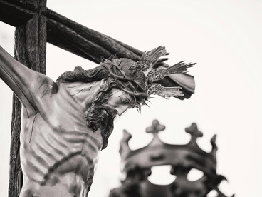 Grayscale photograph of a crucifix depicting Jesus in a church in Carmona, Andalusia, Spain