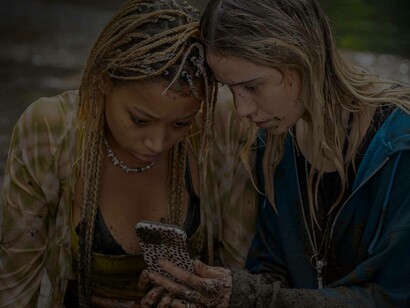 Amber Midthunder beaten up and bloodied is hiding from the Prey (2022) which was released in August