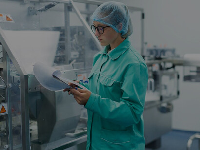 In a stainless steel-equipped clean room, a worker utilizes cutting-edge food preservation methods