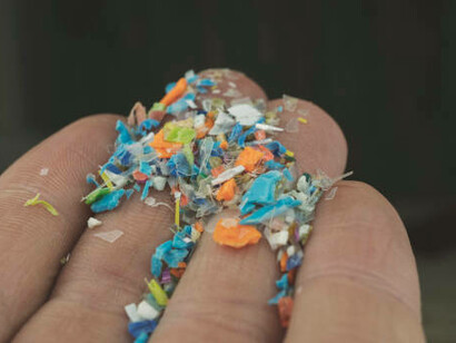 microplastic particles in a human hand