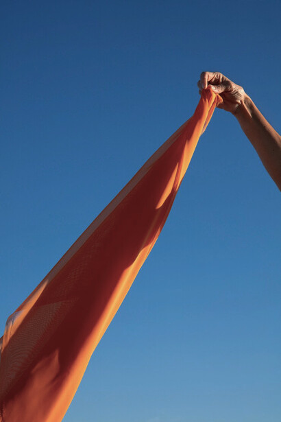 Flowing in the breeze, the fabric symbolizes the future of sustainable, biodegradable textiles