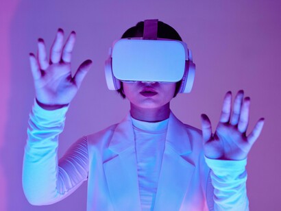 A woman trying to grasp what isn't actually in front of her because of the AI technology