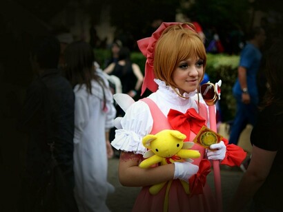 Cosplayer vestida de Cardcaptor Sakura. A maioria, se não todas, as obras do grupo são do gênero shoujo ou voltadas para o público feminino, mas de forma surpreendente elas acabaram conquistando todos os públicos, com Cardcaptor Sakura sendo sua obra de maior sucesso