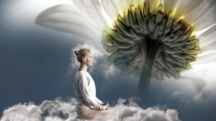 A woman floats in the clouds of imagination during her zen meditation time