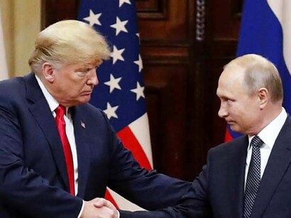 La stretta di mano tra Trump e Putin