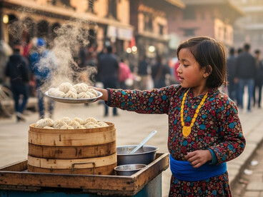 A young Nepali girl, dressed in colorful traditional attire, sells momos—Nepal’s beloved dumplings—on the lively streets of Kathmandu. She stands behind a small wooden cart filled with steaming baskets of freshly made momos, capturing the warmth and vibrancy of everyday street life