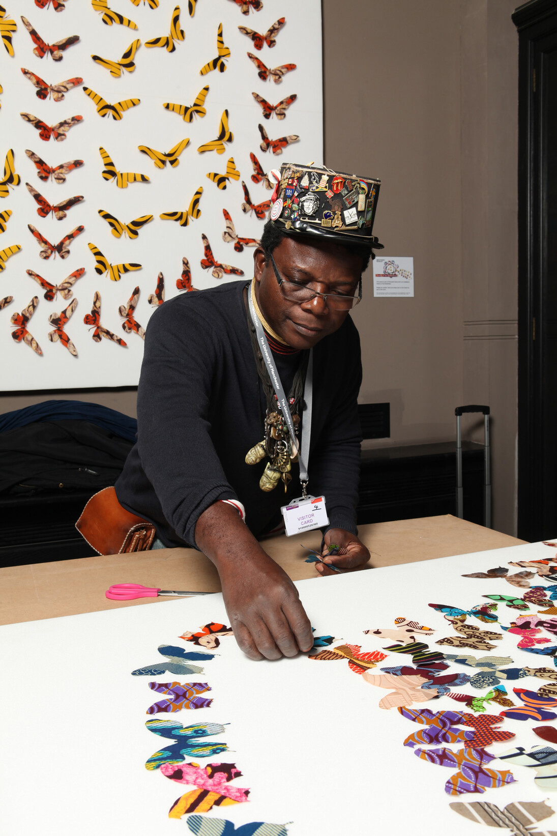 Romuald Hazoumè installs Dance of the Butterflies. Photo Alan Seabright