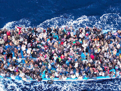 Hundreds of refugees and migrants before being rescued by the Italian Navy