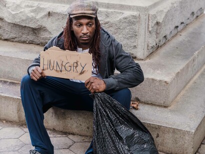 Man with a 'hunger' sign