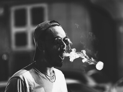 Making smoke circles after taking a vaping hit