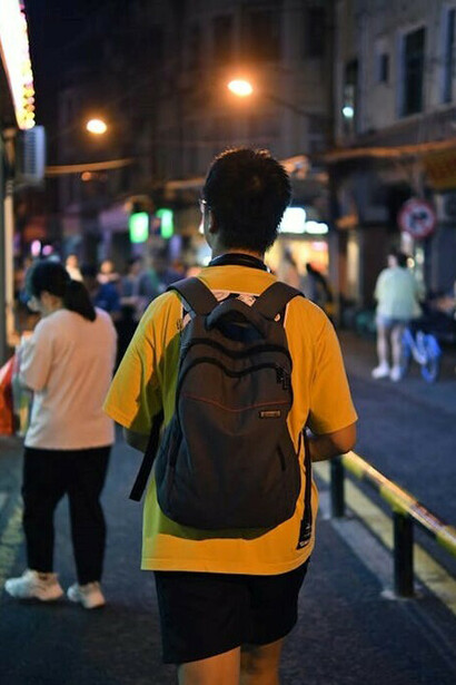 People walking the streets of Shenzhen at night