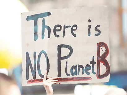 A person holds a sign that boldly states, "there is no planet b", Lorenzer Platz, Nuremberg, Germany