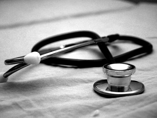 A stethoscope rests unused, a symbol of a healthcare system where, as exposed by Ramparts Magazine, profit and bureaucracy often outweighed patient care