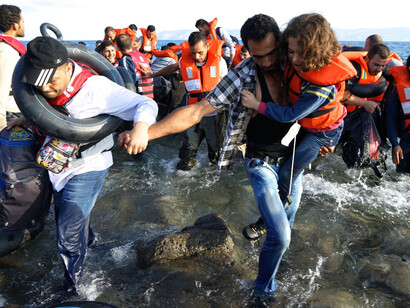 Boat of migrants landing in Greece
