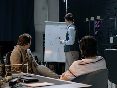Startup professionals discussing growth strategies, reflecting the culture of continuous iteration that powers lean organizations