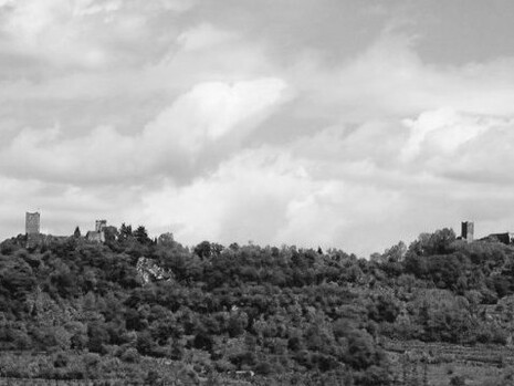 Across the valley, the twin castles of Romeo and Juliet face each other in eternal silence—two stone witnesses to a love that was never lived, only dreamed