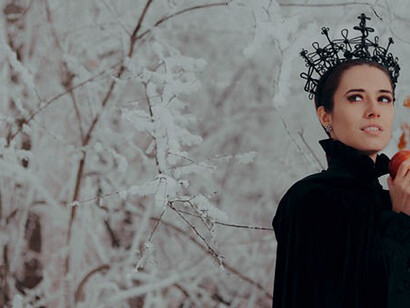 Clutching the poisonous apple, the evil queen's sinister intentions gleam