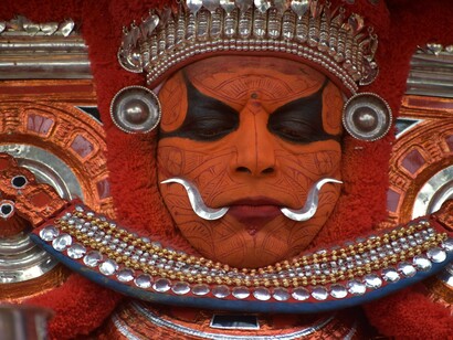 Theyyam, a Hindu ritual dance from Kannur, Kerala, is performed in Malabar's temples and sacred groves. With around 400 forms, it is seen as a divine channel through which devotees seek blessings, India